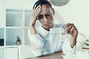 Young Sick Woman in White Shirt Sitting in Office.