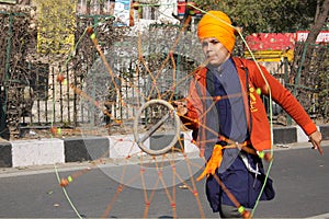 An young sikh boy performing with a chakkar