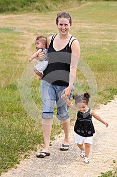 Young single mother family walking