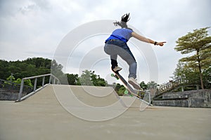 Young skateboarder practice ollie trick photo