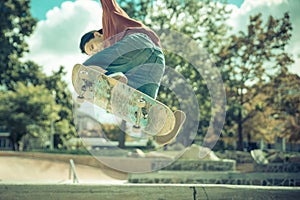 Young skateboarder practicing in the skate park