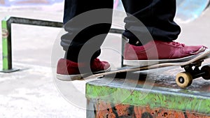 Young skateboarder skating the outdoor skatepark