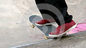 Young skateboarder skating the outdoor skatepark