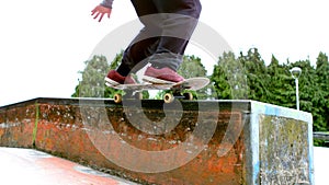 Young skateboarder skating the outdoor skatepark