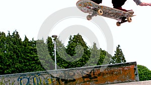 Young skateboarder skating the outdoor skatepark