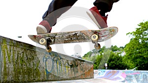 Young skateboarder skating the outdoor skatepark