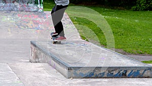 Young skateboarder skating the outdoor skatepark