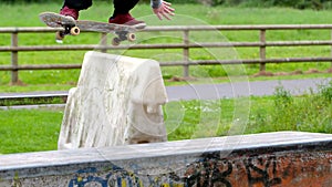 Young skateboarder skating the outdoor skatepark