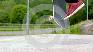 Young skateboarder skating the outdoor skatepark