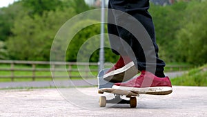 Young skateboarder skating the outdoor skatepark