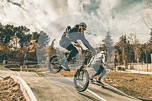 Young skateboarders and bmx bikes. Young people practicing urban sports