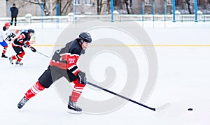 Young skater man in attack. Ice hockey game