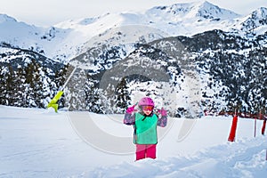 Young skier, girl having fun on the snow. Winter ski holidays in Andorra