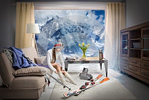 young skier wearing warm socks and dreaming about snowy mountains, ski equipment lying