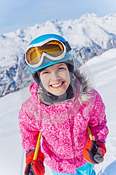 Young skier in winter resort