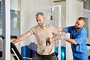 young skilled physician supporting man in