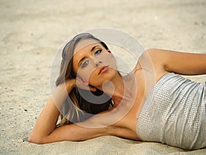 Young Skinny Woman Reclining In Sand Confident