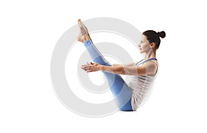 Young slender girl is engaged in yoga and gymnastics.