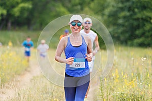 Young slim fitness girl running trail cross race