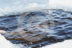 young, slim, handsome, sporty man , diving into ice-cold water