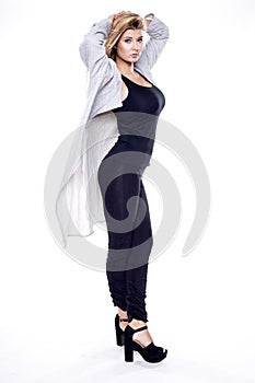 Young slim woman in fashionable dress isolated on white bac