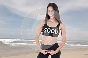 Young slim woman outdoor on beach in summer sportswear clothes