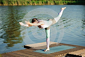 Young slim yoga woman making beautiful asana exercises. Healthy lifestyle.