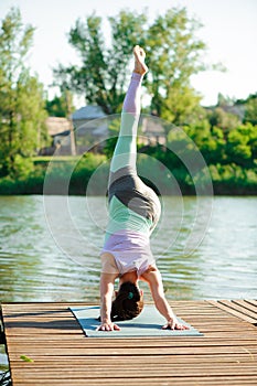 Young slim yoga woman making beautiful asana exercises. Healthy lifestyle. Stretching