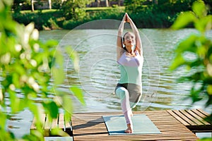 Young slim yoga woman making beautiful asana exercises. Healthy lifestyle. Stretching