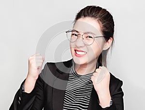 Young smart beautiful asian business woman wore black suit and glasses,smart and thinking holding Document, talking phone