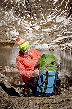 Young smiley backpacker arrived to Zabie pleso