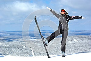 Young smiley woman skier