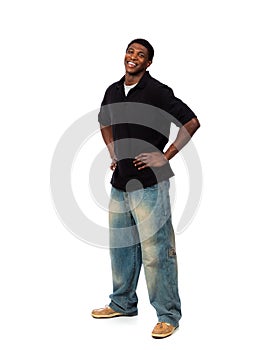 Young smiling African American male standing on a white background