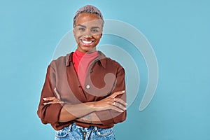 Young smiling African American woman student crossing arms in front of chest