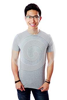 Young smiling asian man standing