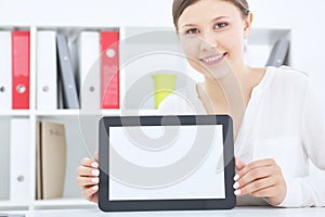 Young smiling Asian woman showing tablet computer screen smiling.