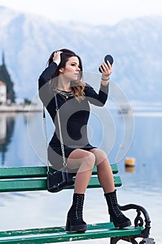 Beautiful young girl resting on the sea photo