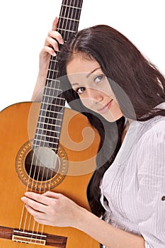 Young smiling brunette with acoustic guitar