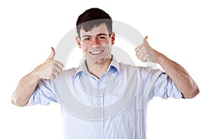 Young smiling business man shows both thumbs up