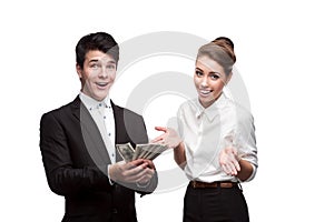 Young smiling business people holding money