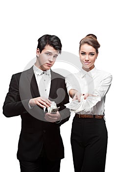 Young smiling business people holding money