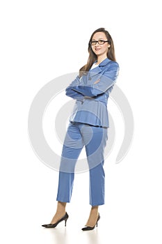 Young smiling business woman with crossed arms