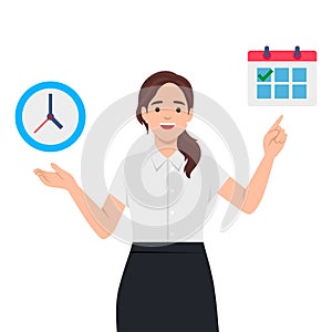 Young smiling business woman pointing to calendar and clock.Time management, timing, self organization, business planning concept