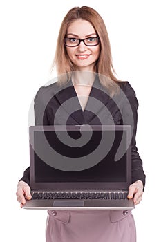 Young smiling business woman presenting laptop