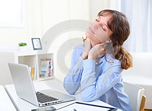 Young smiling business woman relaxing at work