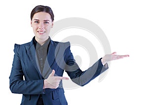 Young smiling business woman in suit with empty hand, copyspace, studio shoot isolated on white.