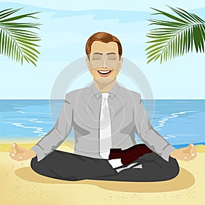 Young smiling businessman doing yoga on tropical beach