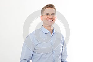 Young smiling businessman isolated on white background. Copy space and mock up. Man in blue template and blank shirt.