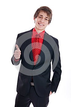 Young smiling businessman showing thumb up.