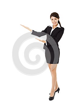 Young smiling businesswoman with showing gesture